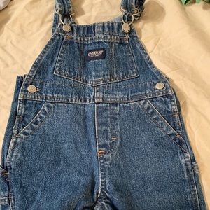 Osh kosh denim overalls.